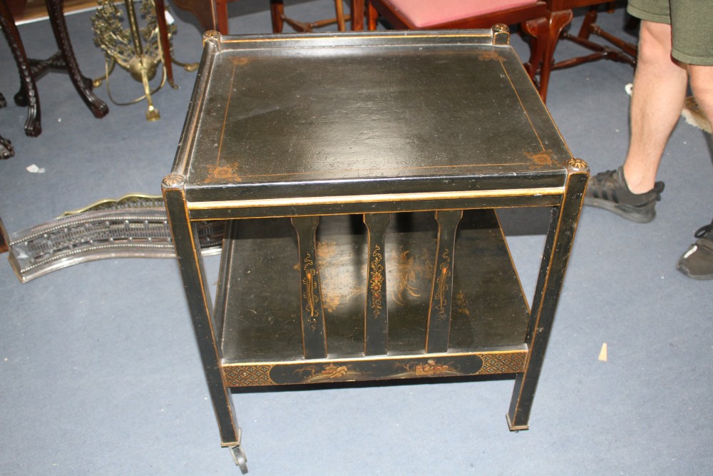 A 1920s black lacquered two tier trolley, with gilt floral decoration, W.63cm D.55cm H.71cm